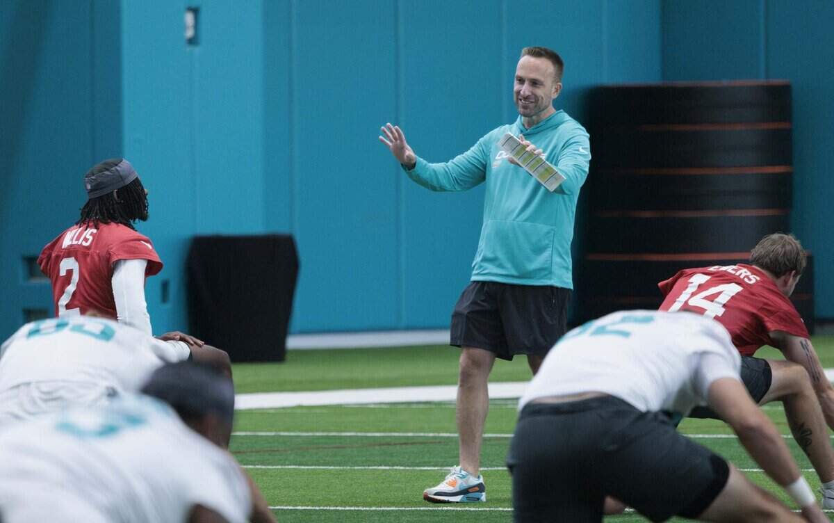 Head Coach Jeff Hafley speaks to quarterback Malik Willis (2) during Miami Dolphins organized training activities on Tuesday, May 19, 2026, at Baptist Health Training Complex in Miami Gardens, Fla.